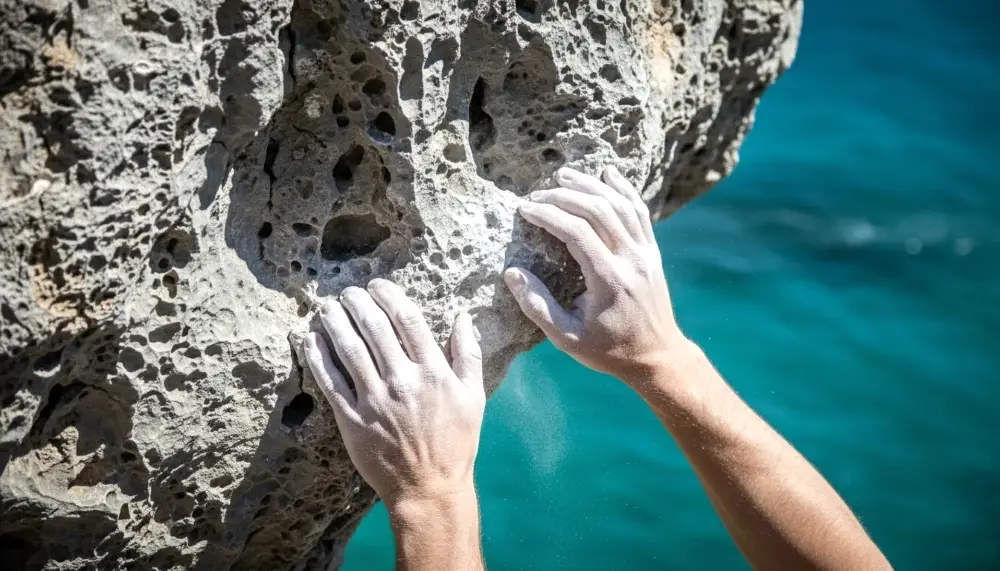 rock climbing chalked hands