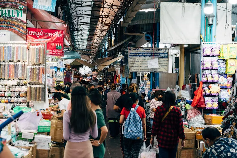 A Crowded Market In Bangkok With People Shopping At Various Stalls Sho