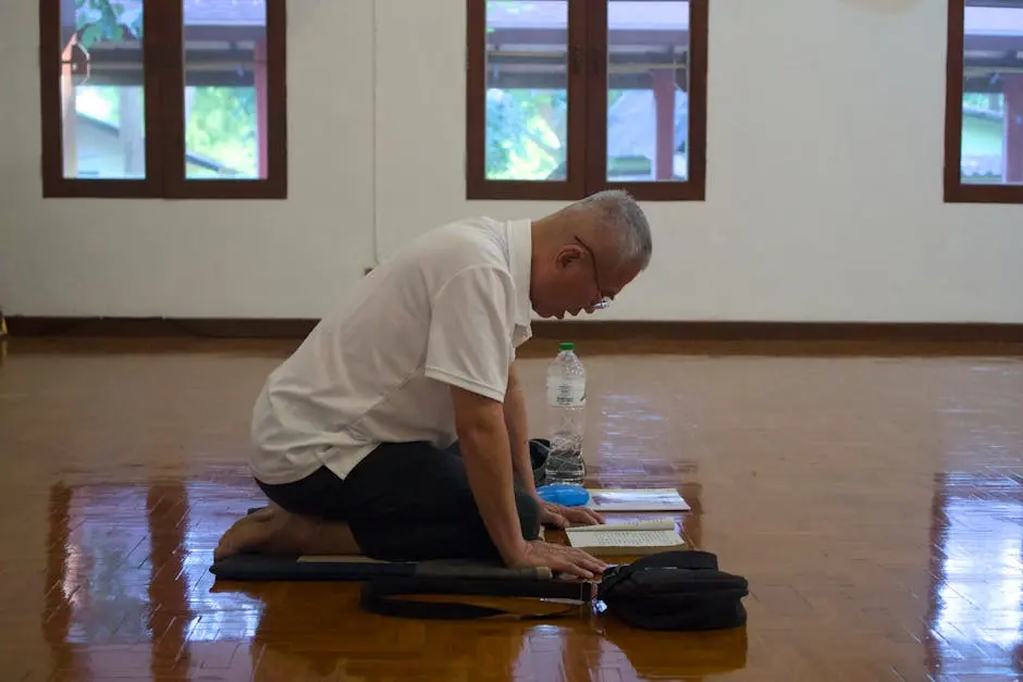 A Man Engaged In Meditation Inside A Serene Chiang Mai Temple Reflecti