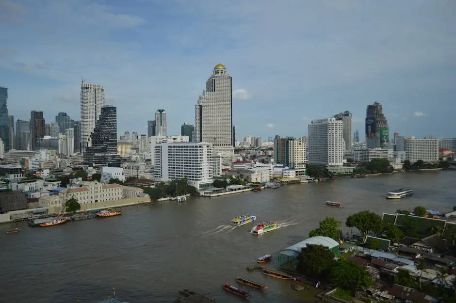 A Scenic View Of Bangkok S Skyline Along The Chao Phraya River With Bo