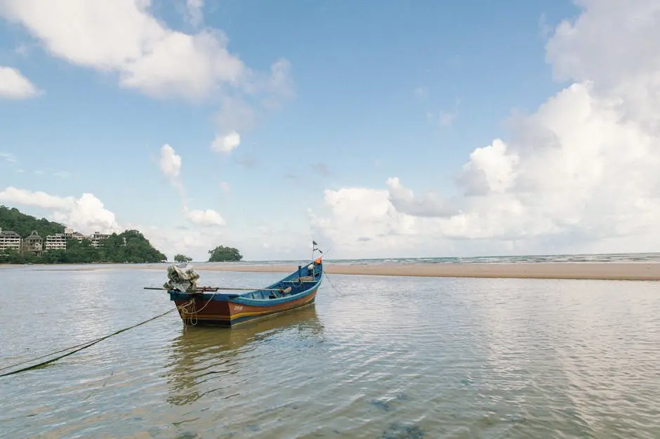 A Serene View Of A Traditional Longtail Boat Anchored On A Beach In Ph
