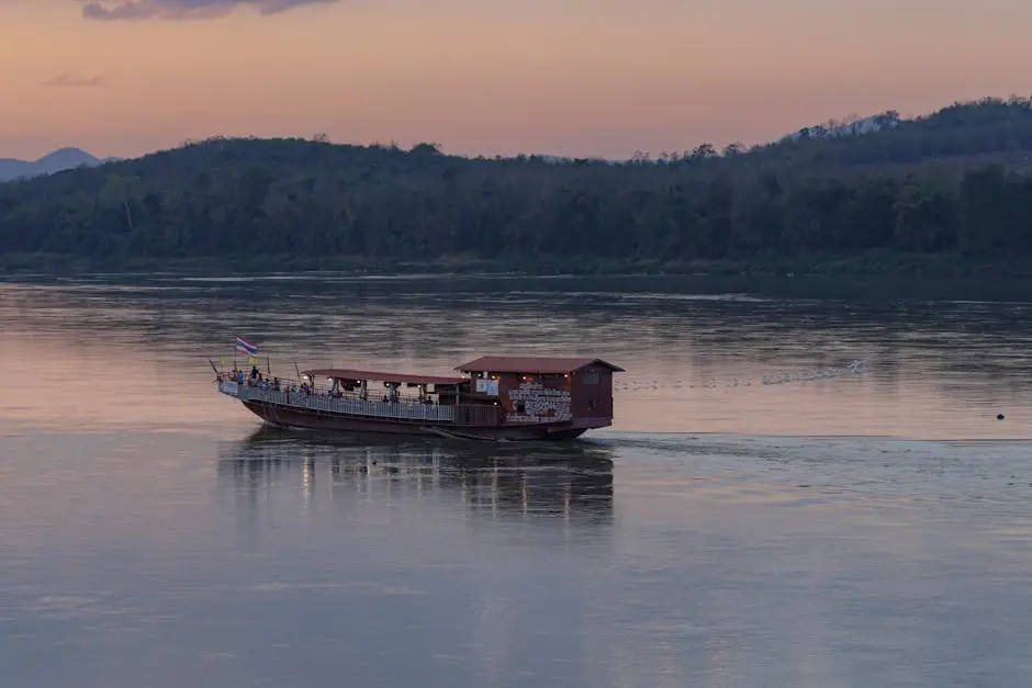A Tranquil Evening View Of A Boat On The Mekong River At Sunset In Chi