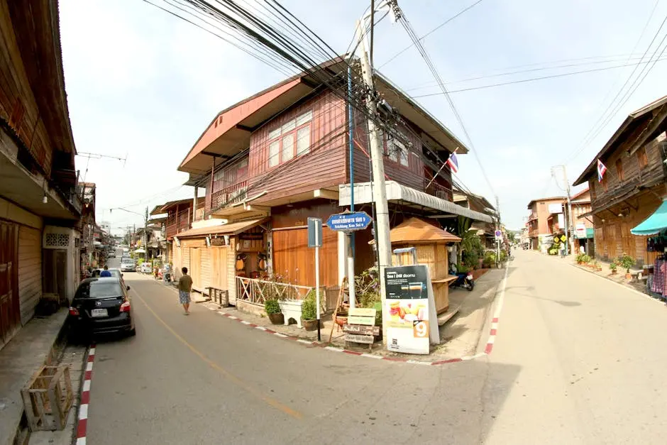 A Vibrant Day Scene Of A Traditional Wooden Street In Southeast Asia W