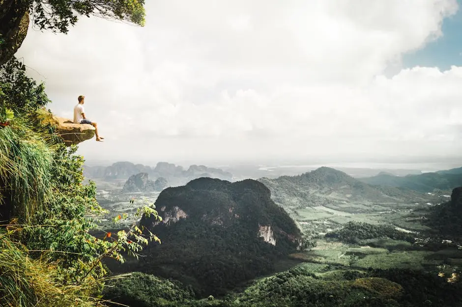 Adventure Seeker Enjoys A Breathtaking View From A Cliff In Krabi Thai