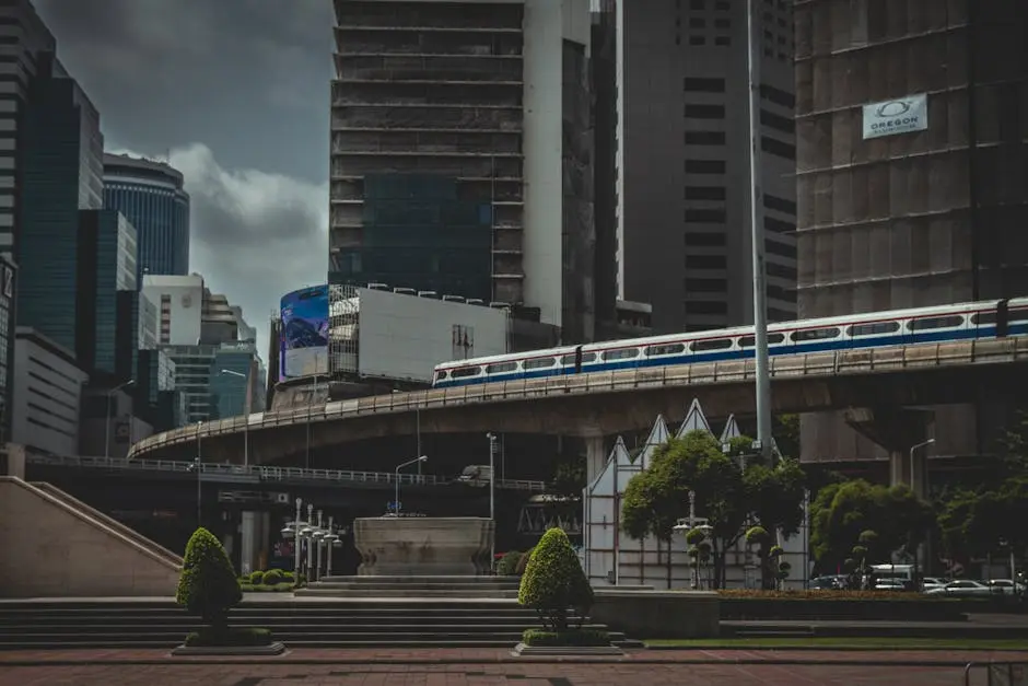 Bangkok Skyline Featuring Skyscrapers And A Moving Train On An Elevate