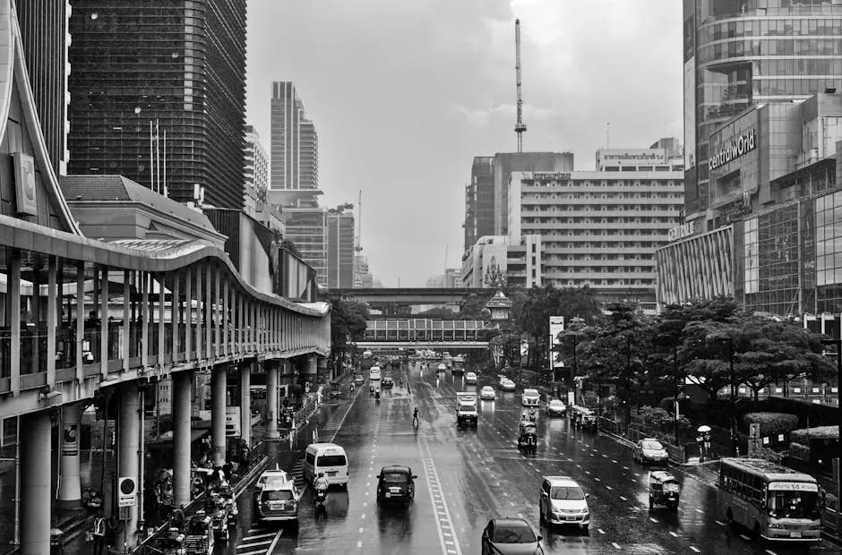 Black And White Photo Of Bangkok S Bustling City Center With Rainy Str