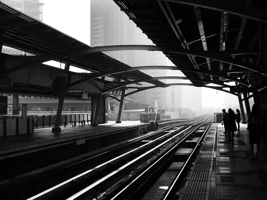 Black And White Unrecognizable People Waiting For Train On Platform Of