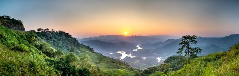 Breathtaking Landscape Of Green Hills With Trees And Bushes Near River