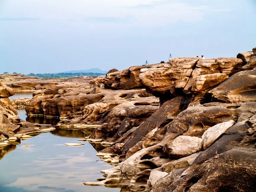 Breathtaking View Of Rocky Landscape By Water In Sam Phan Bok A Natura