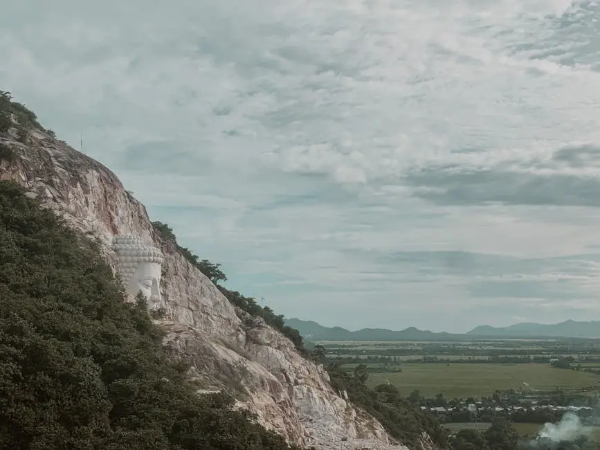 Buddha Sculpture On A Mountain Cliff In Ch U C An Giang Vietnam Surrou