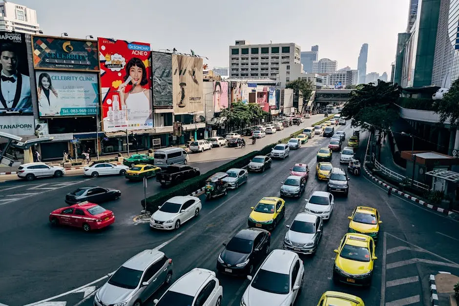 Busy Traffic Scene In Downtown Bangkok Thailand With Cars And Billboar