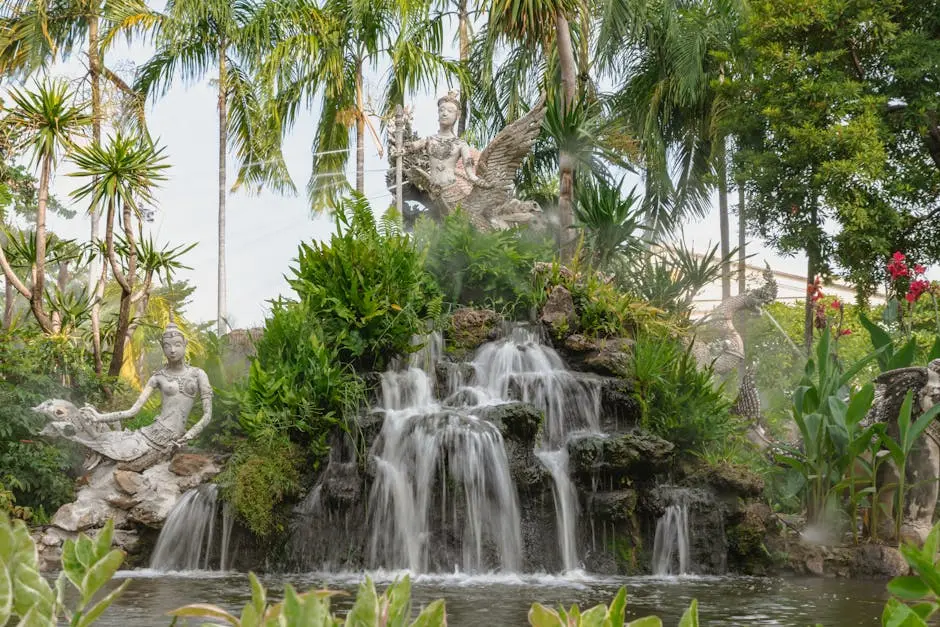 Captivating Sculpture Garden In A Bangkok Park With Waterfall And Trop