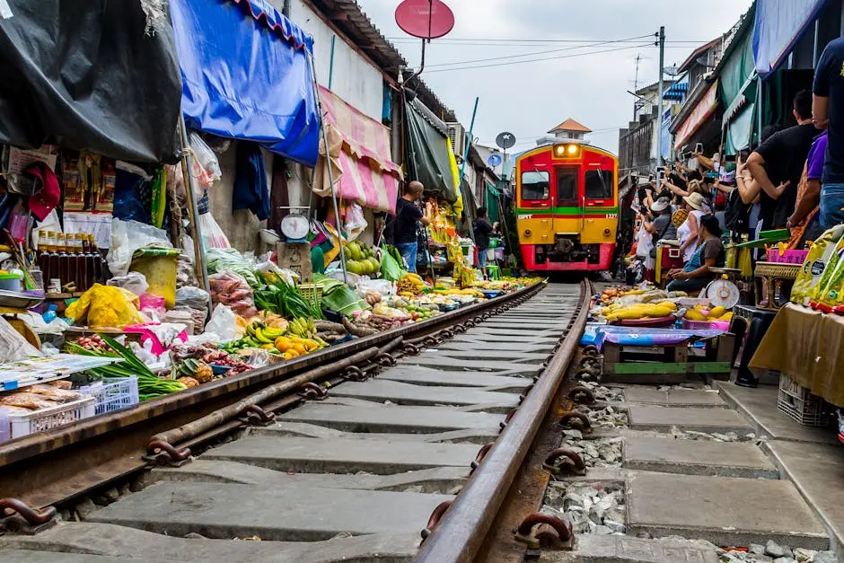 Capture The Excitement Of Mae Klong Market In Thailand With A Train Pa