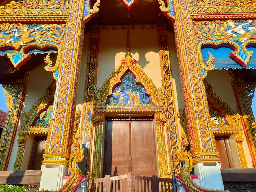 Colorful And Ornate Thai Temple Entrance Showcasing Intricate Designs