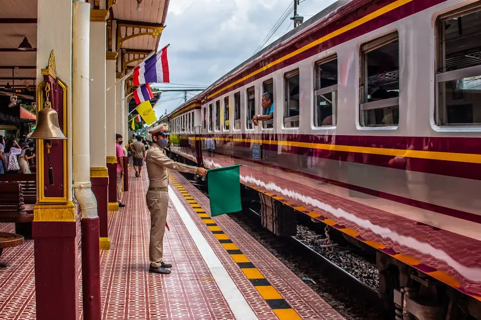 Conductor Directing Train At Ayutthaya Railway Station In Thailand Vib