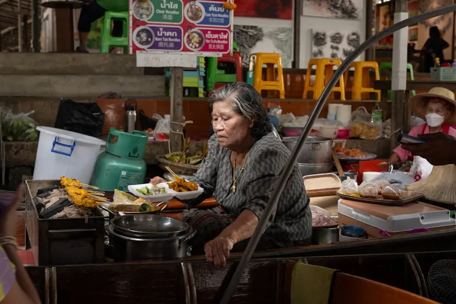 Elderly Woman Cooking Traditional Thai Dishes At A Bustling Bangkok St