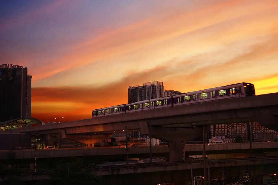 Elevated Train Against A Dramatic Sunset Sky In Bangkok Representing U