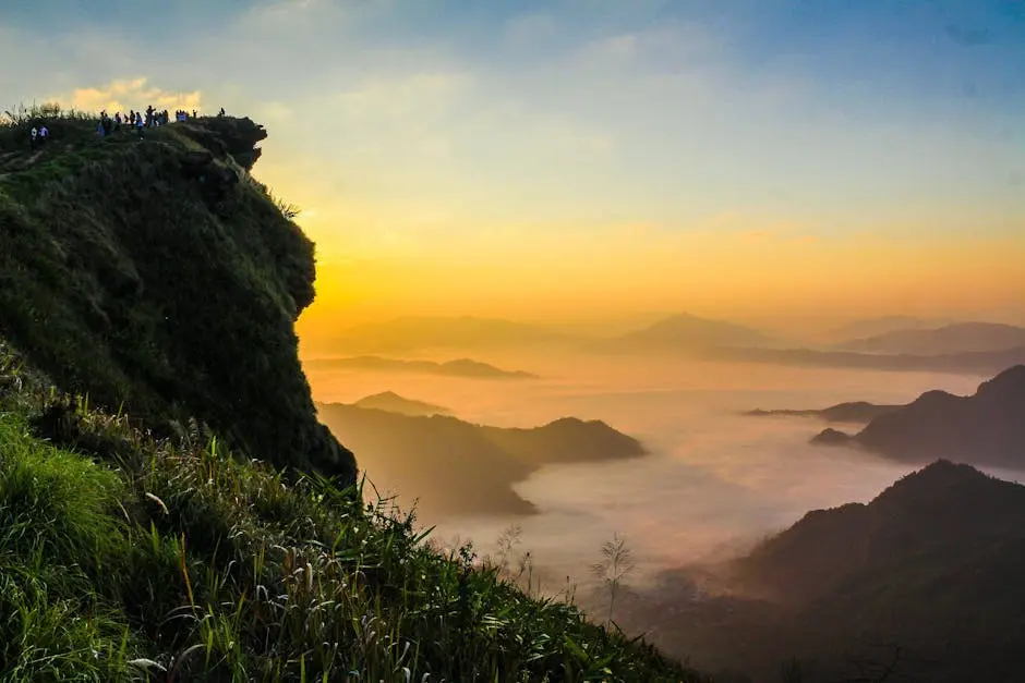 Experience A Stunning Sunrise View From A Mountain Cliff Enveloped In