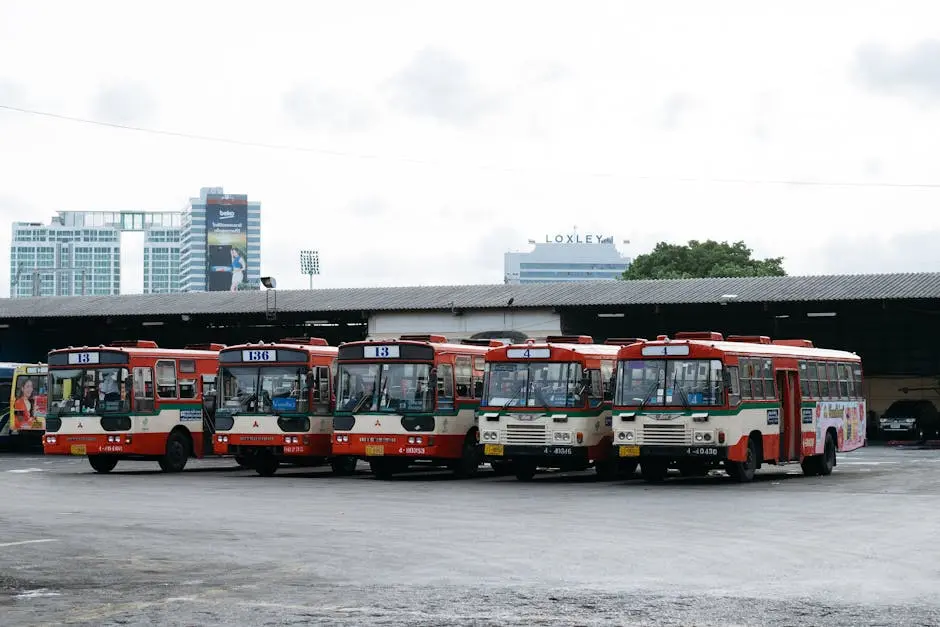 Five Public Buses Lined Up At A Bus Terminal In Bangkok Thailand