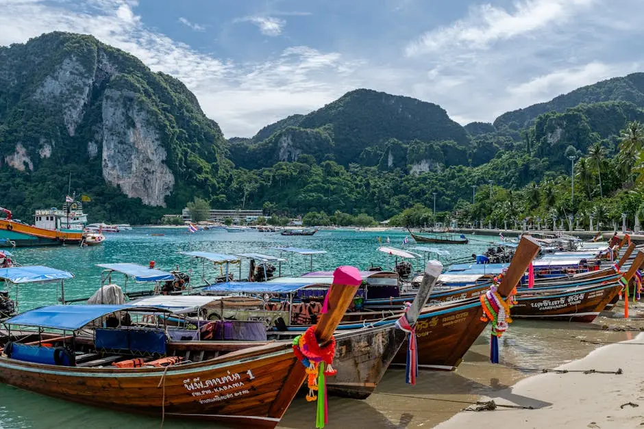 Longtail Boats Lined Up At A Stunning Beach In Phuket Thailand With Lu