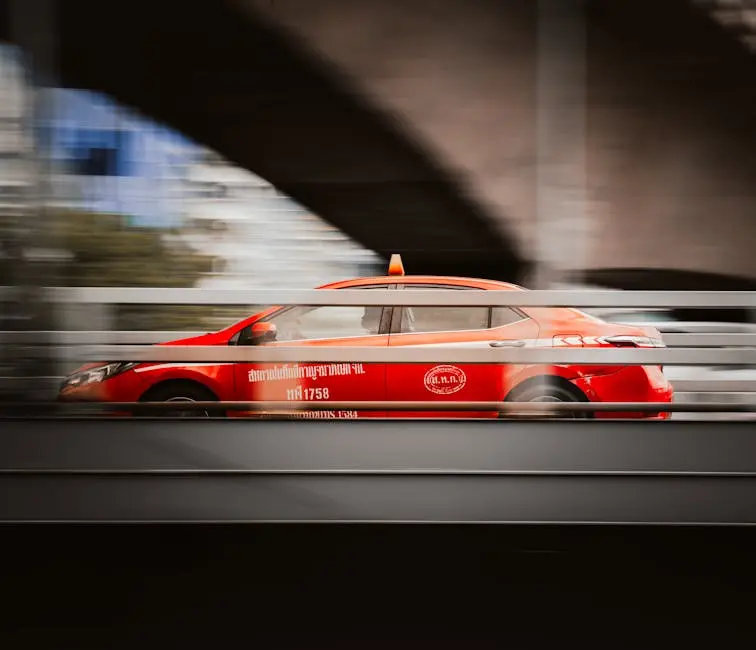 Motion Blur Of A Red Taxi Speeding Through The Bustling Streets Of Ban
