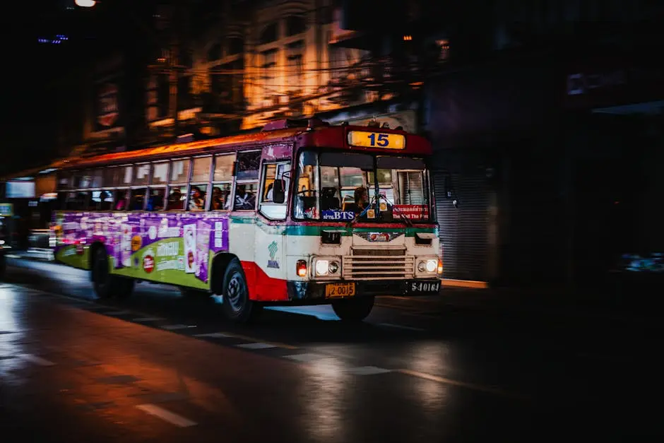 Nighttime Street Scene With A Colorful Bus In Motion In Bangkok Showca