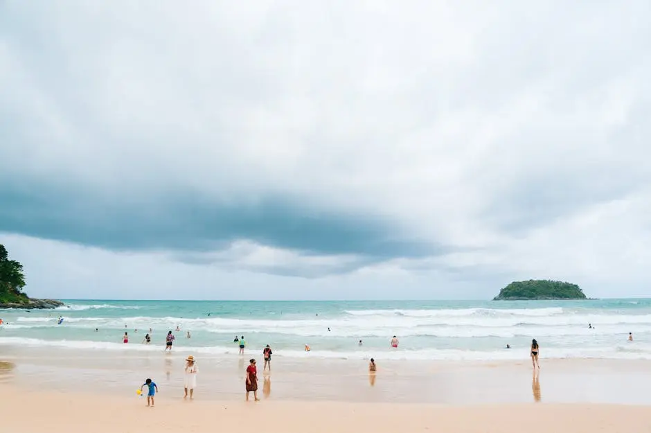 Relaxing Day At Kata Beach Phuket With People Enjoying The Ocean And B