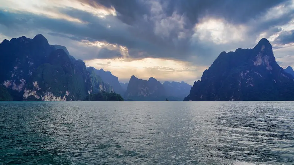 Scenic View Of Khao Sok Lake With Dramatic Skies And Limestone Mountai