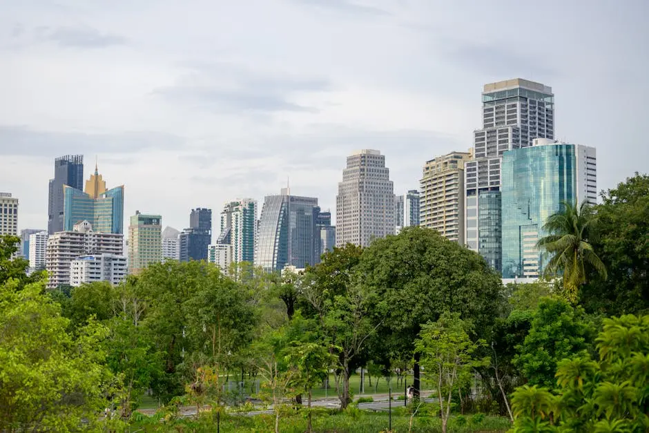 Serene Park Landscape With Towering Skyscrapers In The Background