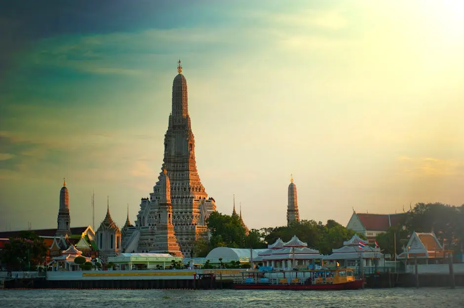 Stunning Sunset View Of Wat Arun Temple By The Chao Phraya River In Ba