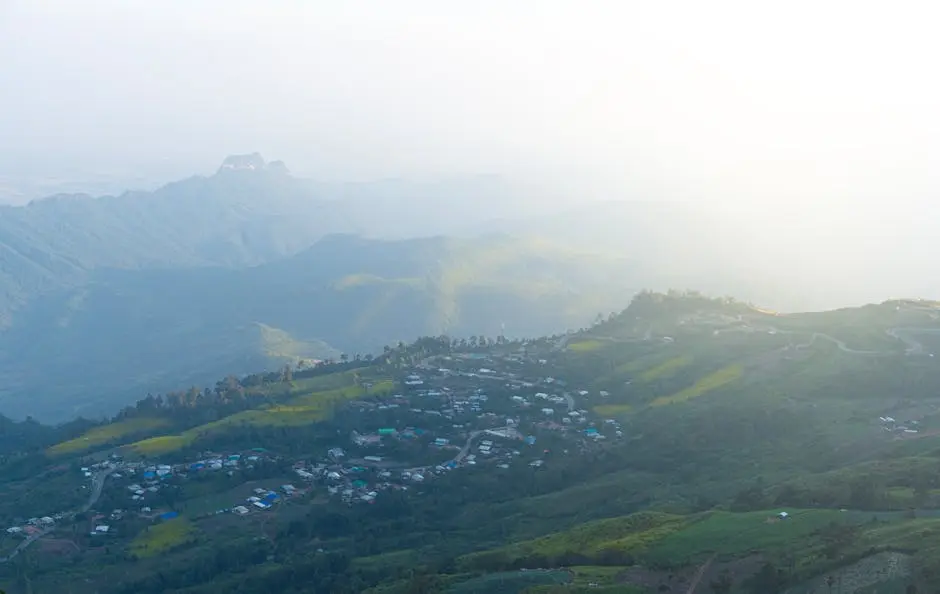 Tranquil View Of A Misty Mountain Village At Sunrise In Thailand