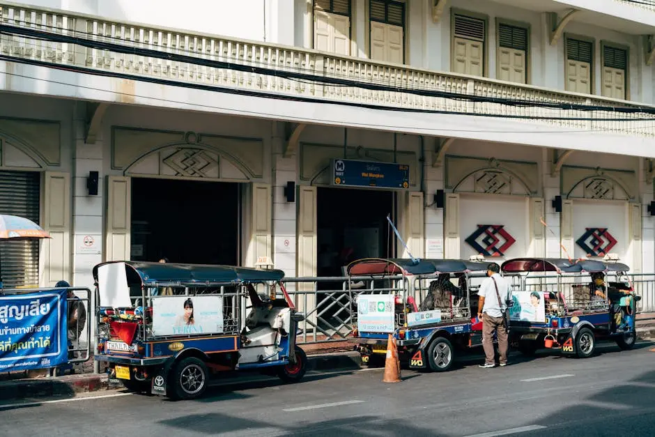 Tuk Tuks Waiting Outside A Building In Bustling Bangkok Thailand