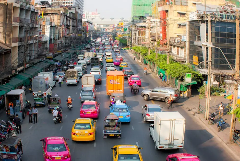 Vibrant City Street Bustling With Traffic And Pedestrians Showcasing U