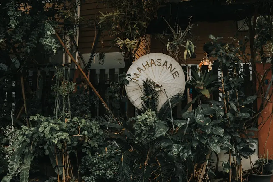 Vibrant Garden With Tropical Plants And A Decorative Umbrella In Bangk
