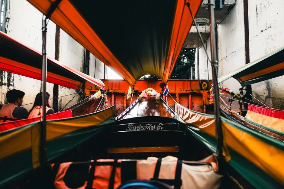 Vibrant Longtail Boat In A Bangkok Canal Offering A Unique Perspective