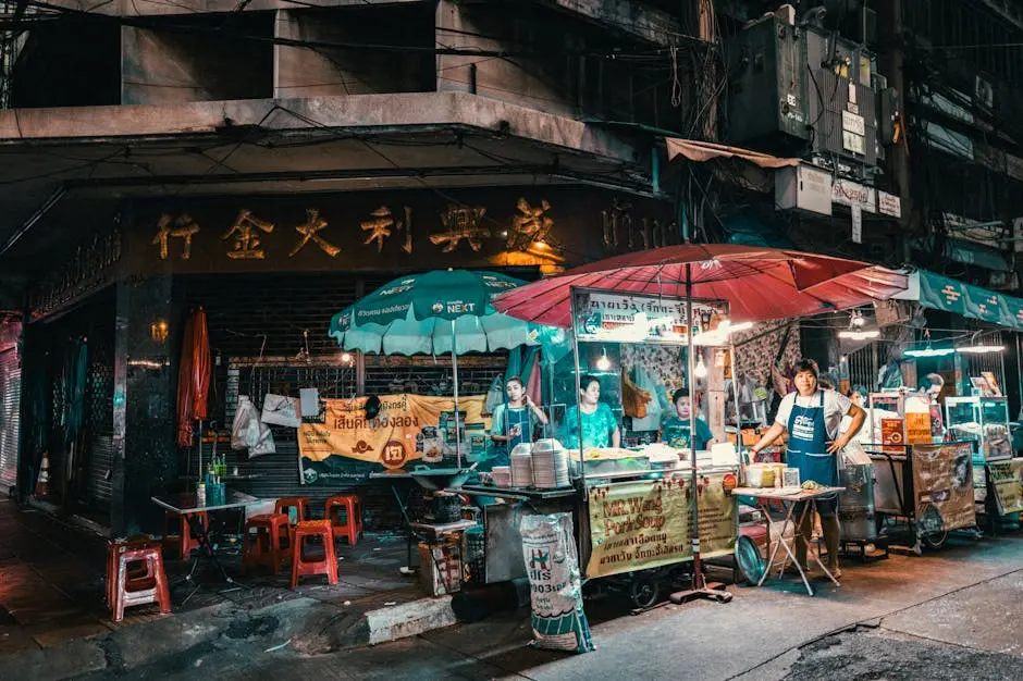 Vibrant Night Market Scene In Bangkok Showcasing Street Food Vendors A