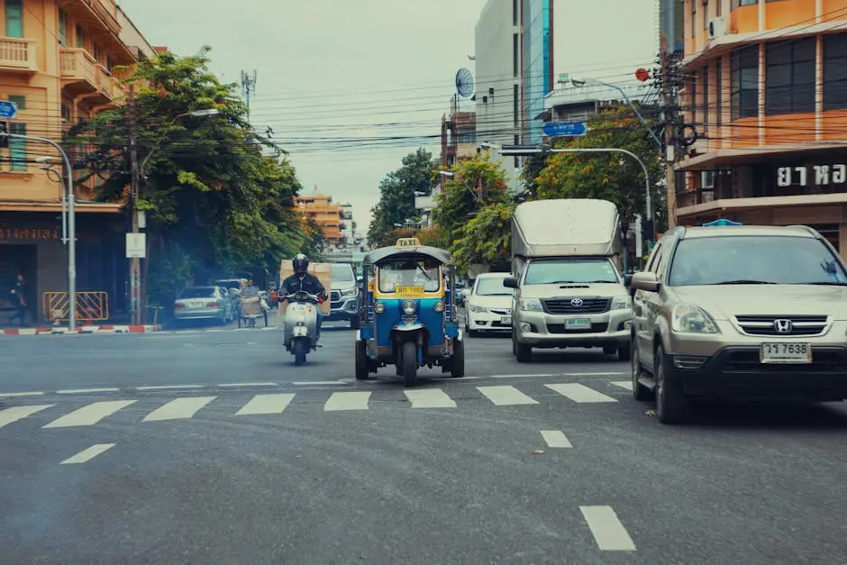 Vibrant Street Scene In Bangkok Featuring A Tuk Tuk Motorbikes And Urb