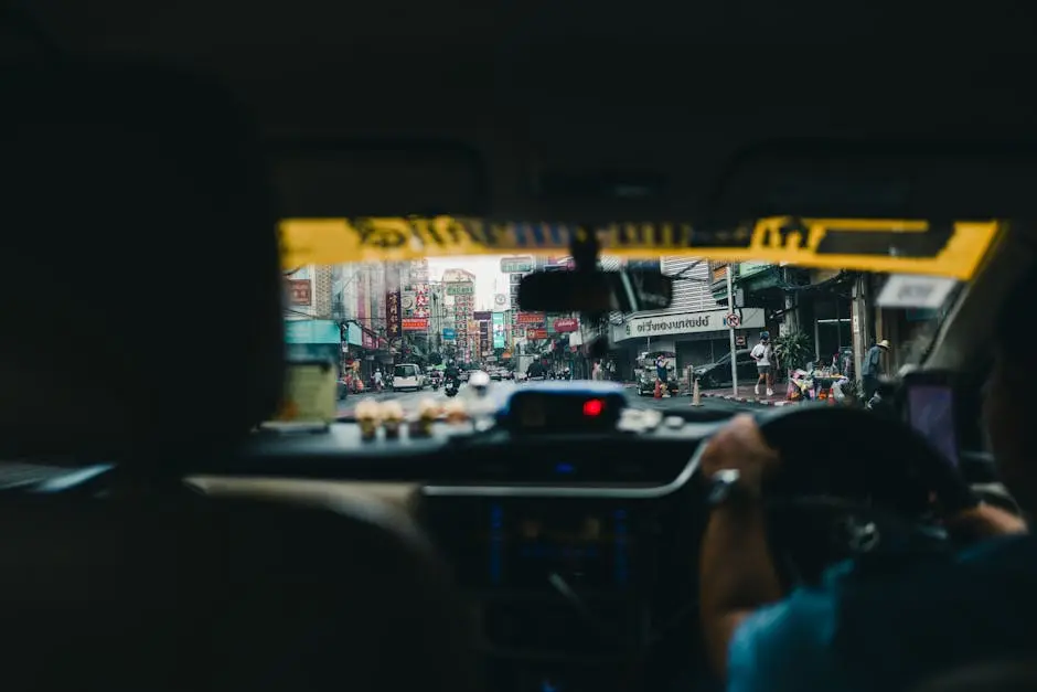 View Of Bangkok S Lively Streets From Inside A Car Showcasing Urban Li