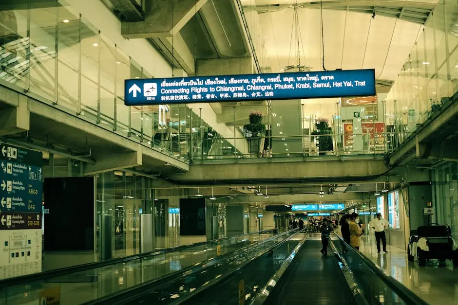 View Of Suvarnabhumi Airport Interior With Moving Walkway And Signs Fo