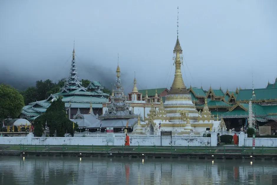 Wat Chong Kham Temple Surrounded By Mist With Reflections On The Pond