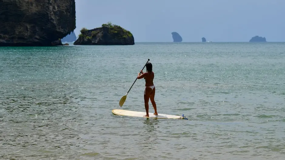 Woman Paddleboarding By Limestone Cliffs In Krabi Thailand Perfect Sum