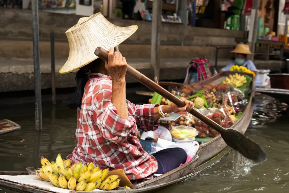 Woman Paddling Boat At A Vibrant Floating Market In Bangkok Thailand